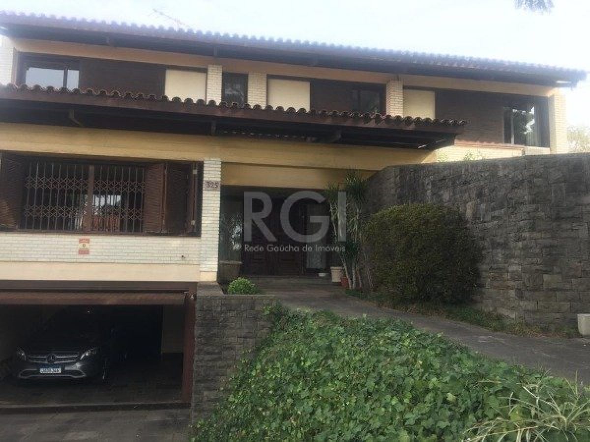 Casa à venda com 406m², 3 quartos, 1 suíte, 4 vagas no bairro Três Figueiras em Porto Alegre - Foto 1