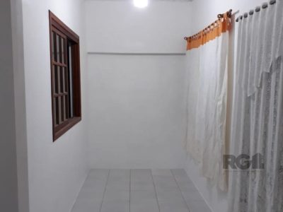 Casa à venda com 200m², 3 quartos, 1 suíte, 2 vagas no bairro Santa Tereza em Porto Alegre - Foto 13