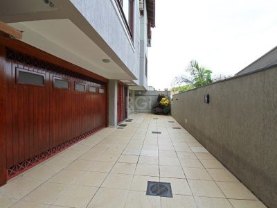 Casa Condominio à venda com 118m², 3 quartos, 1 suíte, 2 vagas no bairro Medianeira em Porto Alegre - Foto 33