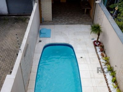 Casa à venda com 110m², 4 quartos, 1 suíte, 4 vagas no bairro Partenon em Porto Alegre - Foto 24