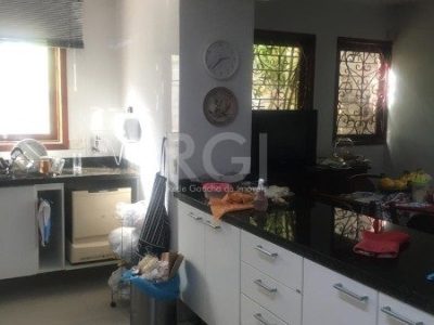 Casa à venda com 406m², 3 quartos, 1 suíte, 4 vagas no bairro Três Figueiras em Porto Alegre - Foto 7