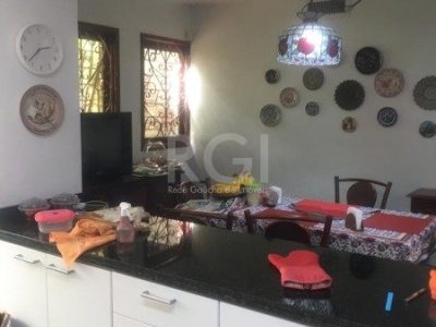 Casa à venda com 406m², 3 quartos, 1 suíte, 4 vagas no bairro Três Figueiras em Porto Alegre - Foto 10