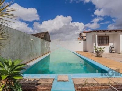 Casa à venda com 414m², 4 quartos, 1 suíte, 4 vagas no bairro Santo Antônio em Porto Alegre - Foto 9