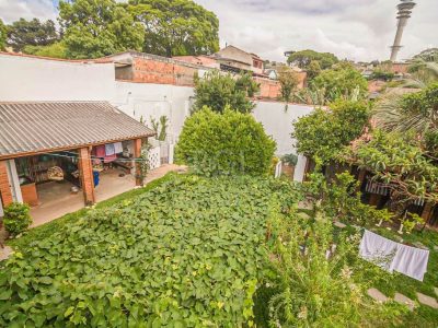 Casa à venda com 440m², 3 quartos, 1 suíte, 2 vagas no bairro Santa Tereza em Porto Alegre - Foto 22