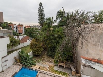 Casa à venda com 540m², 5 quartos, 4 suítes, 4 vagas no bairro Três Figueiras em Porto Alegre - Foto 14