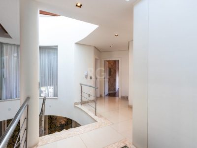 Casa à venda com 463m², 4 quartos, 4 suítes, 4 vagas no bairro Ipanema em Porto Alegre - Foto 31