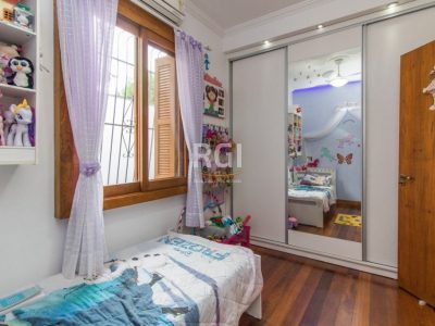 Casa à venda com 396m², 5 quartos, 2 suítes, 5 vagas no bairro Santo Antônio em Porto Alegre - Foto 13