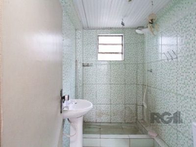 Casa à venda com 100m², 5 quartos, 1 vaga no bairro Santo Antônio em Porto Alegre - Foto 30