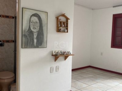 Casa à venda com 230m², 3 quartos, 1 suíte, 4 vagas no bairro Santa Tereza em Porto Alegre - Foto 7