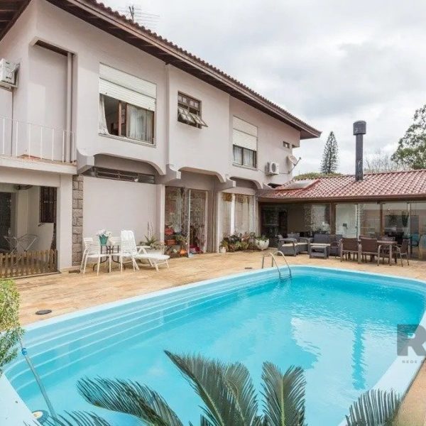 Casa à venda com 277m², 3 quartos, 3 suítes, 5 vagas no bairro Jardim Lindóia em Porto Alegre - Foto 1